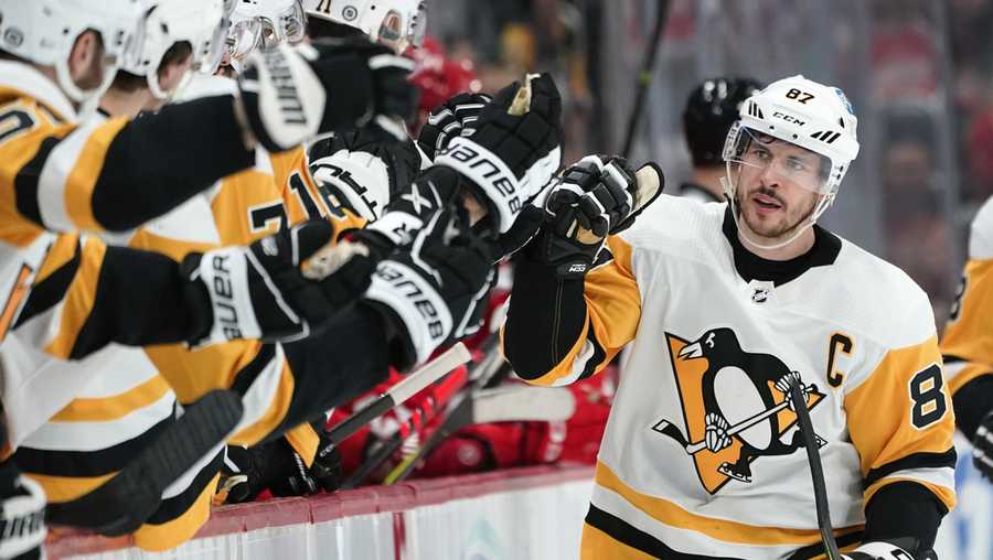 Pittsburgh Penguins center Sidney Crosby (87) celebrates his goal against the Detroit Red Wings in the first period of an NHL hockey game Saturday, April 8, 2023, in Detroit. (AP Photo/Paul Sancya)