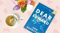 dear edward novel with bouquet of flowers and cup of tea